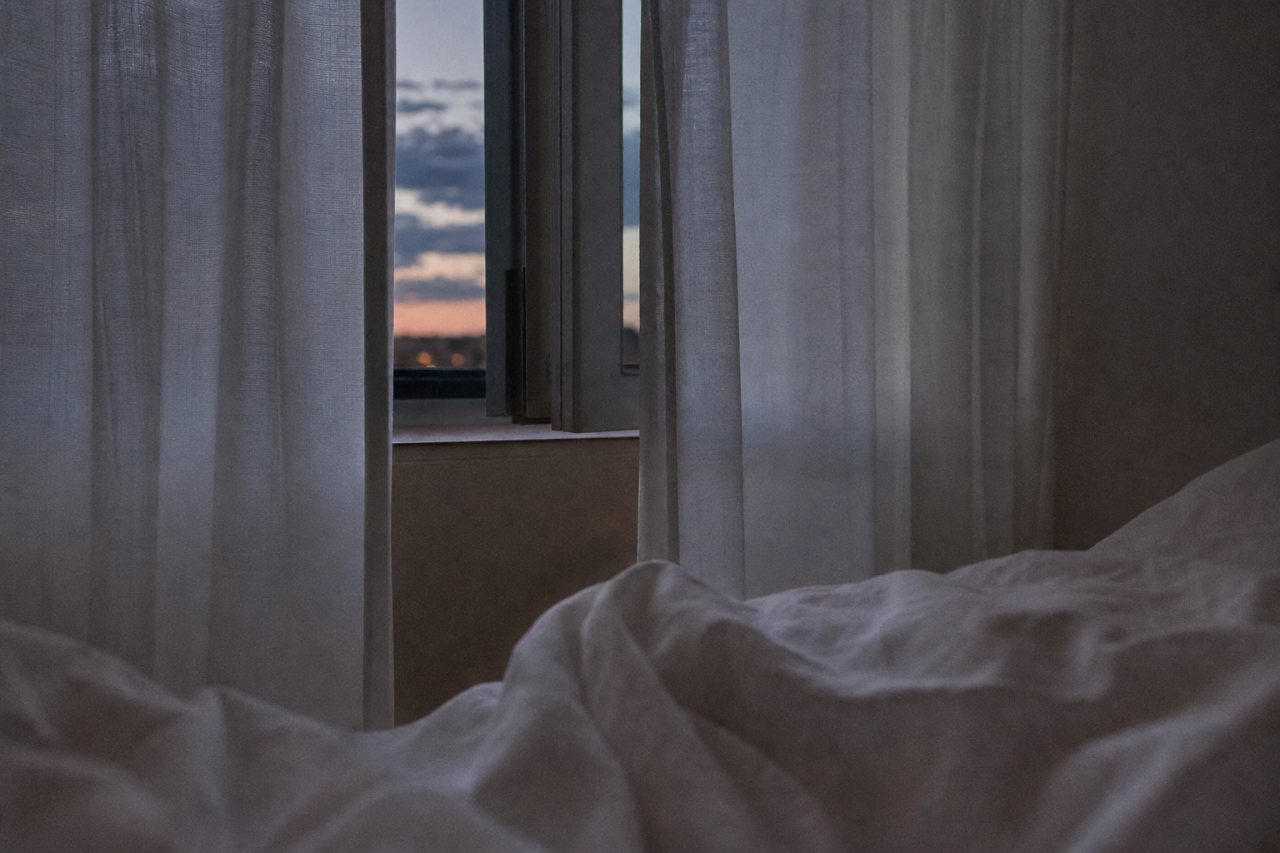 A bedroom at dusk
