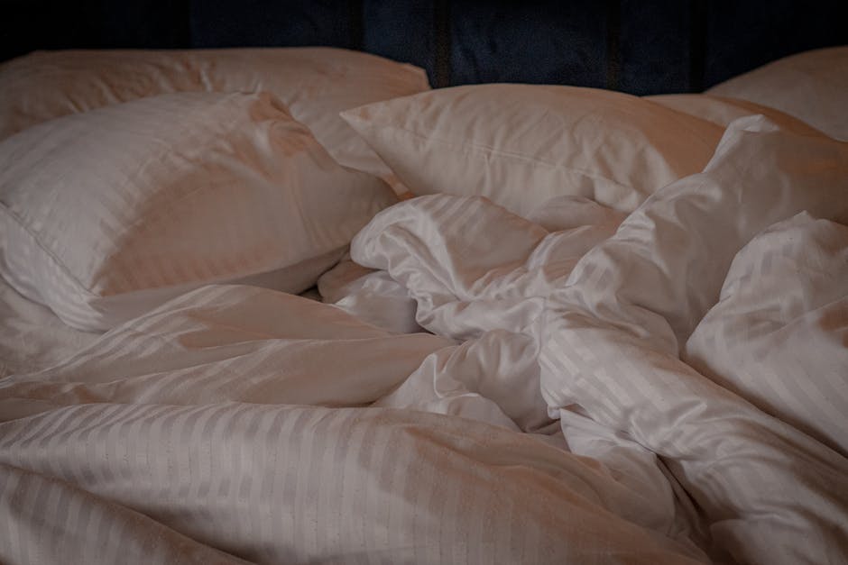 Soft layered bedding on a bed — a CertiPUR-US label certifies the foam inside, not the whole mattress