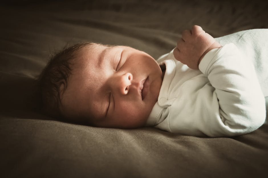 A young child sleeping — two 2025 studies measured chemical exposure where children sleep